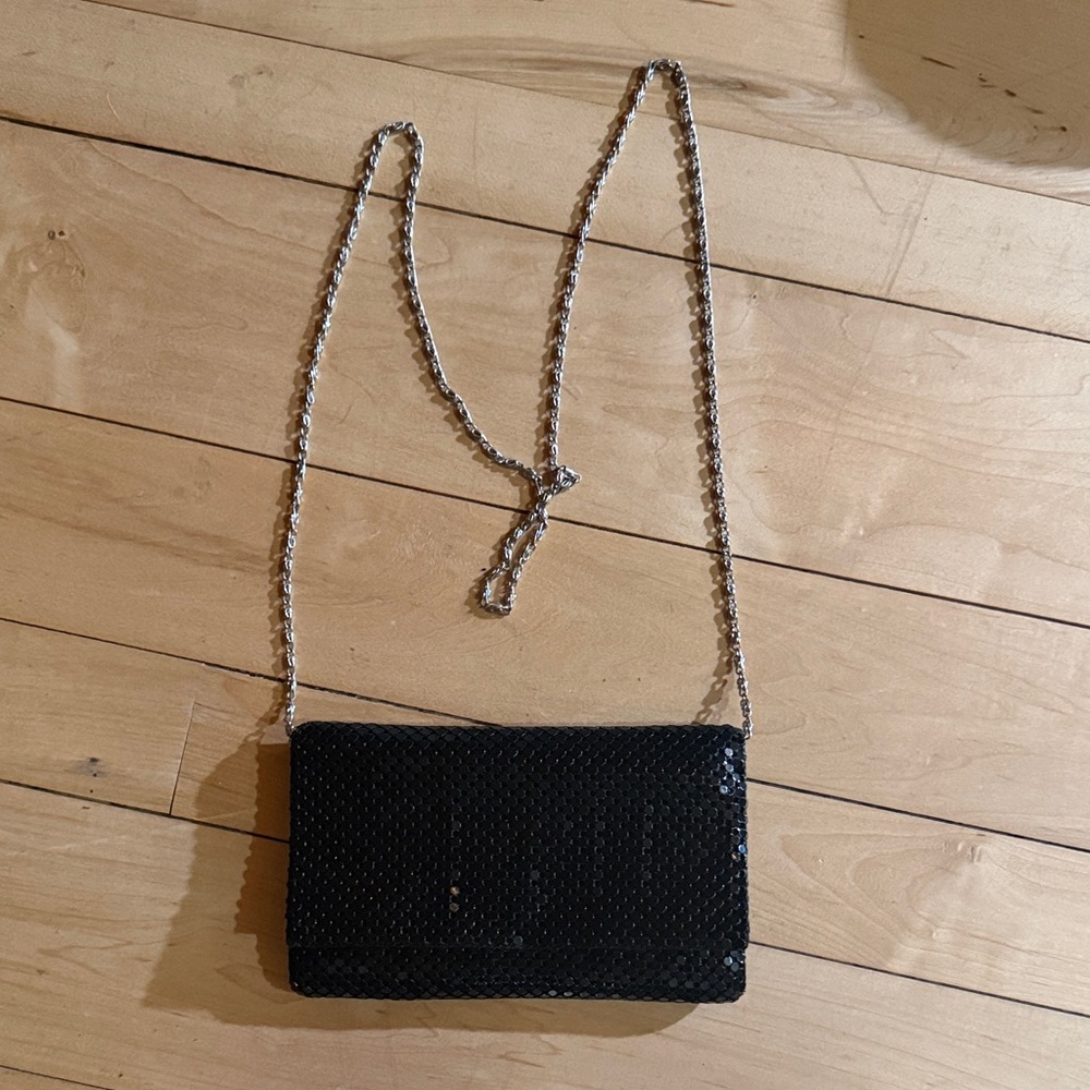 Jessica McClintock’s Black Sequin Clutch, adorned with a silver vintage .